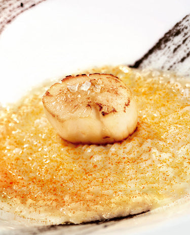 foto ricetta Risotto con polvere di pomodoro, olive taggiasche e noce di capasanta 