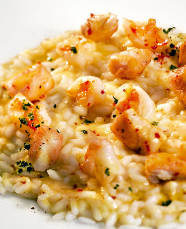foto ricetta Risotto alle vongole crude e zuppa di cocco al curry, mazzancolle e petti di faraona arrostiti 