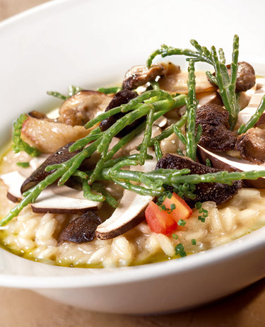 foto ricetta Riso Carnaroli mantecato con crema di carote, baccalà arrostito e tartufo nero confit 