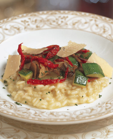 foto ricetta Riso ai funghi selvatici con zucchine, pomodori essicati e parmigiano 