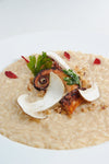Risotto, polpo croccante, carpaccio di porcini e nocciole 